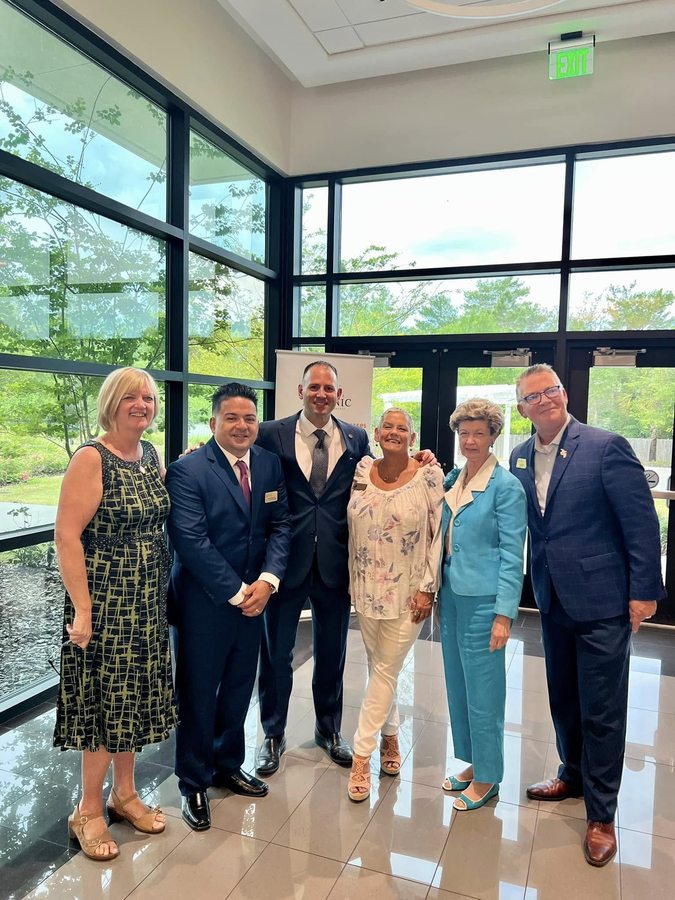 Dana McCool with civic and business leaders at a Deltona community event